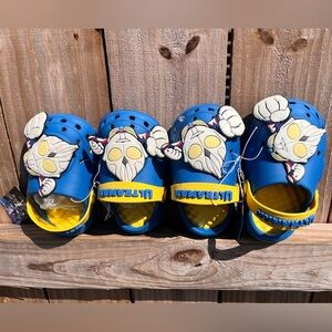 Kids Blue Clogs with large Ultra Man charm on it
